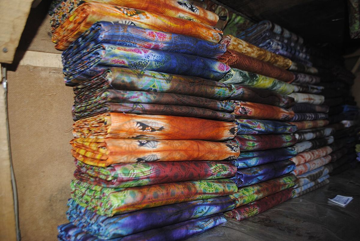 Stacks of folded indigo adire fabric from Abeokuta